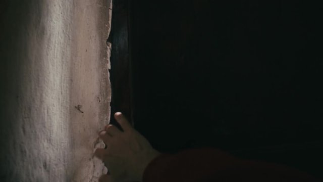 Hand opening door of Medieval gothic mystery church