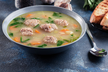 Italian wedding soup with meatballs and vegetables
