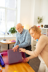 Obraz premium Pleasant grey haired people enjoying their teamwork