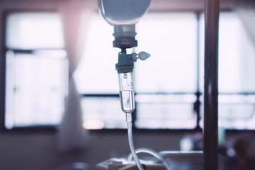 Closeup of IV  Saline Solution Drip in Hospital Treatment Disease, selective focus (detailed close-up shot) 