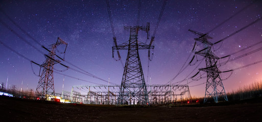 The high voltage tower and the Milky Way at night
