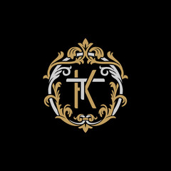 Initial letter T and K, TK, KT, decorative ornament emblem badge, overlapping monogram logo, elegant luxury silver gold color on black background