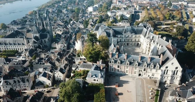 View from drone of French city of Blois with Royal Chateau and church of St. Nicolas in sunny autumn day
