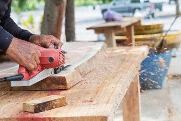 carpenter working on site by tools