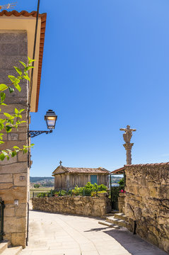 Combarro, Spain. Traditional horreo barn and stone cross