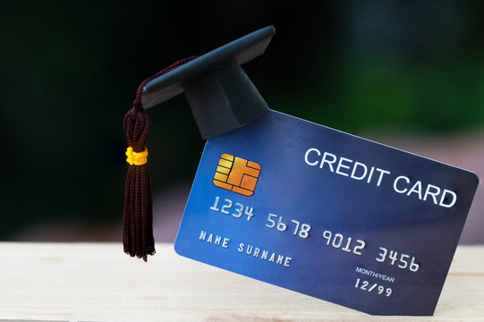 Education payment Credit Card for study Graduate concept: Graduation Cap on Mock up Card, Idea for dept loan playing for successs studying or business have to use so money and alternative risk finance