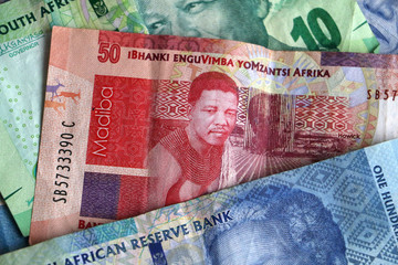 South African rand notes stacked piled up