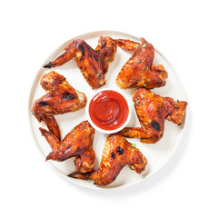 Fried Chicken Wings with sauce isolated on white.