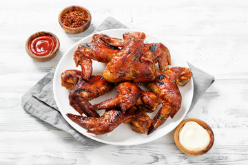 Fried Chicken Wings with sauces.