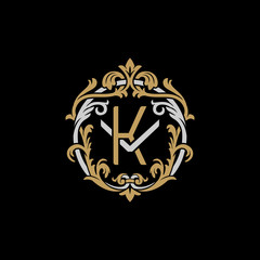 Initial letter V and K, VK, KV, decorative ornament emblem badge, overlapping monogram logo, elegant luxury silver gold color on black background