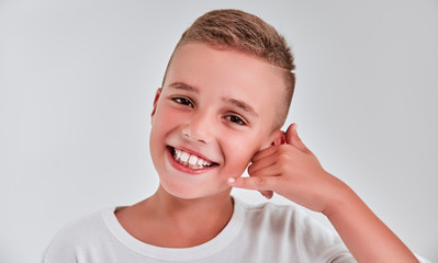 Cute boy on a gray background