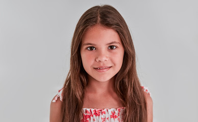 Cute girl on a gray background