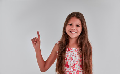 Cute girl on a gray background