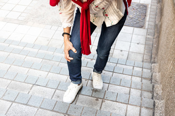 Woman with painful knee struggle walking down flight of stairs