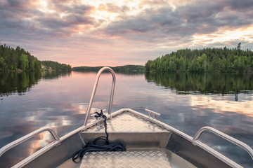 Scenic sunset landscape on boat at beautiful and peaceful summer evening in Finland