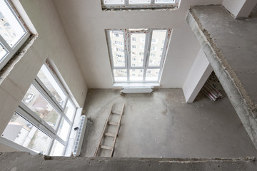 View from the second floor to the first floor in a two-story apartment in a new building