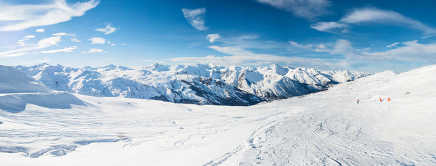 Panoramic view down snow covered valley in alpine mountain range - Powered by Adobe