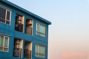 Condominium block city building sunset sky