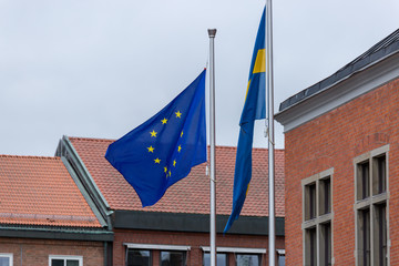 The European Union flag next to the Swedish Flag