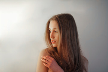Naklejka premium Portrait of a young beautiful long-haired girl.