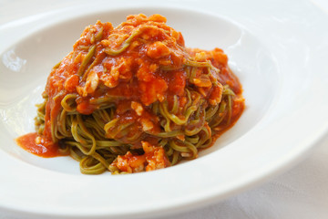 green tagliolini pasta with crab and tomato