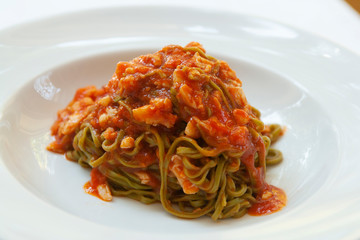 green tagliolini pasta with crab and tomato