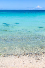 Looking out over the turquoise Caribbean Sea, with a blue sky overhead