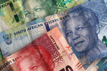 South African rand notes stacked piled up