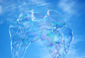 Soap bubble in the air with blue sky