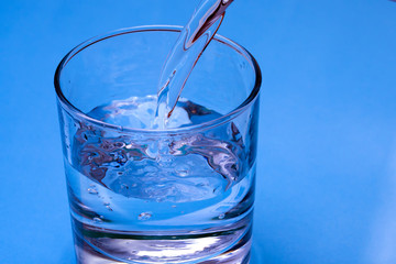 Fresh drinking water. Pure drinking water Pours into a clear glass