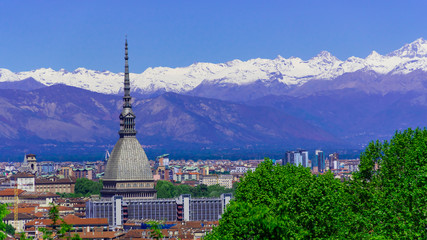 Fototapeta na wymiar Turin, Torino, aerial timelapse skyline panorama with Mole Antonelliana, Monte dei Cappuccini and the Alps in the background. Italy, Piemonte, Turin.