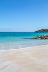 Fototapeta na wymiar An idyllic sandy beach on the Caribbean Island of Antigua