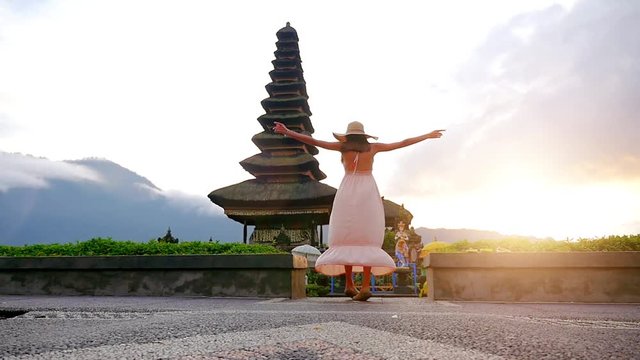 Beautiful girl visiting the ulun danu bratan temple in Bali.