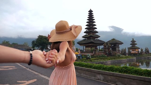 Couple spending time at the ulun datu bratan temple in Bali