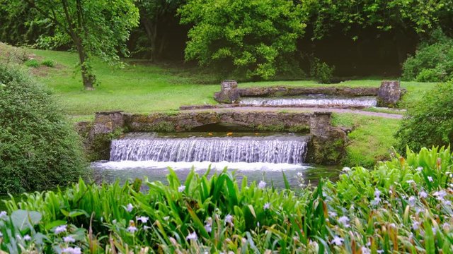 eden garden fountain 4k waterfall background Nymph Garden or Giardino della Ninfa in Lazio - Italy