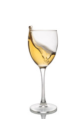 White wine in a wine glass with splashes isolated on white background.