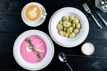 Two plates with the meal on the table, view from above