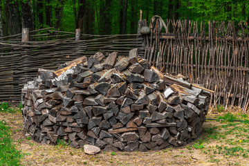 Hardwood. Timber Folded logs. Rural firewood stuffed