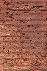 Texture of a red brick wall as a background or wallpaper
