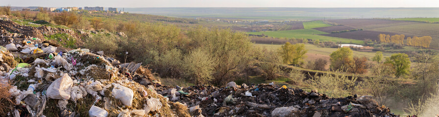 Environmental disaster. Clogging the outskirts of the city. Garbage heaps are an element of the modern European landscape.