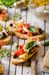Crostini with tomatoes and olives