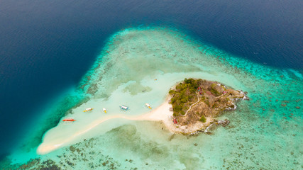 Tropical island Bulog Dos. Tourists walking along the sand bar aerial view.Philippines, Palawan