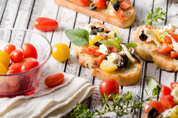 Crostini with tomatoes and olives