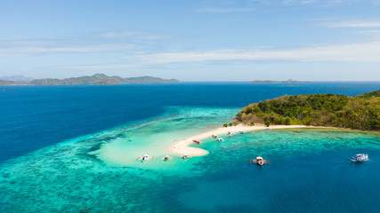 Fototapeta na wymiar aerial seascape tropical island with sand bar, turquoise water and coral reef. Ditaytayan, Palawan, Philippines. tourist boats on tropical beach. Travel tropical concept. Palawan, Philippines