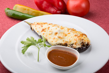 Baked eggplant stuffed with cheese and mushrooms
