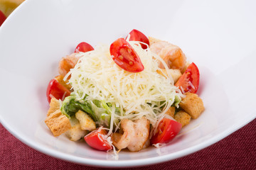 Seafood caesar salad with grilled shrimps