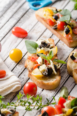 Crostini with tomatoes and olives