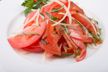 Fresh raw tomato salad with onion
