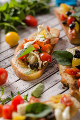 Crostini with tomatoes and olives
