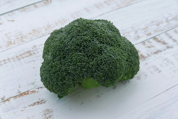 Top view of broccoli on wooden background. 